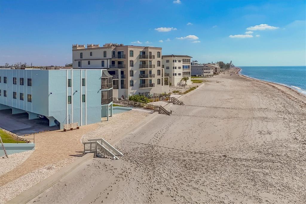 2810 North Beach Road, Unit D205 Englewood, FL 34223 - Photo 42 of 48 a view of a balcony with wooden stairs