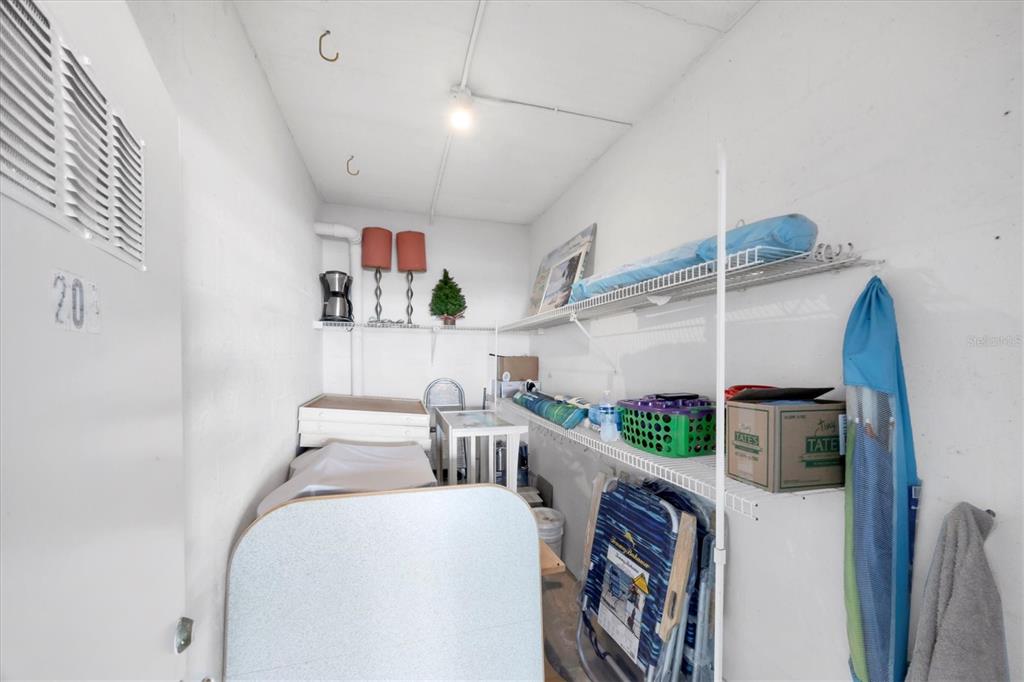 2810 North Beach Road, Unit D205 Englewood, FL 34223 - Photo 48 of 48 a living room with furniture and a floor to ceiling window