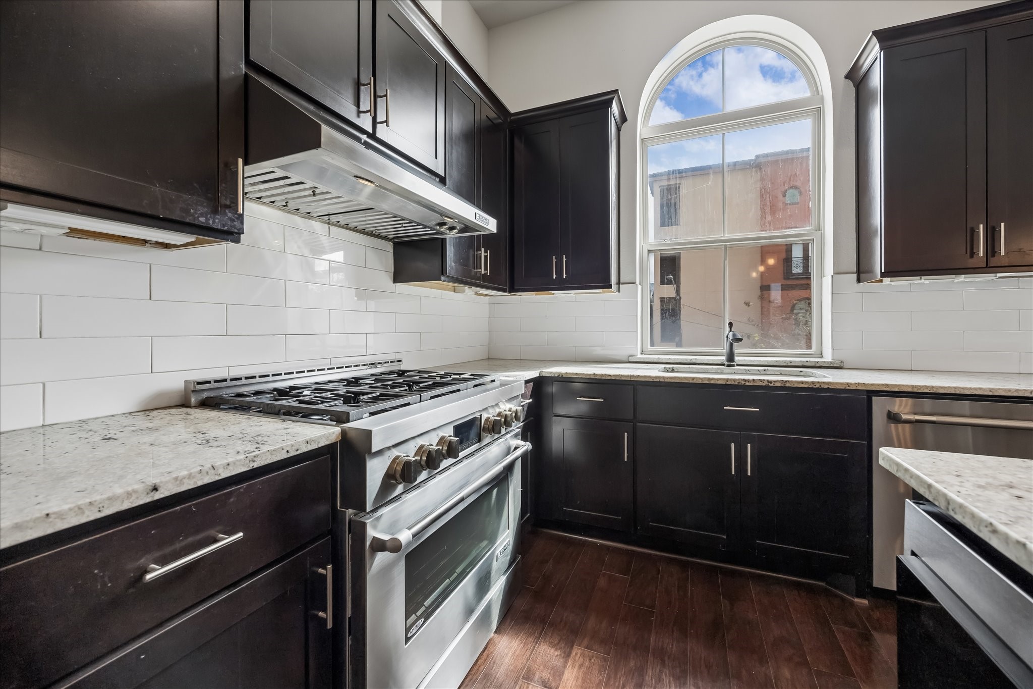 4016 Barnes Street Houston, TX 77007 - Photo 14 of 37 a kitchen with a stove and a sink