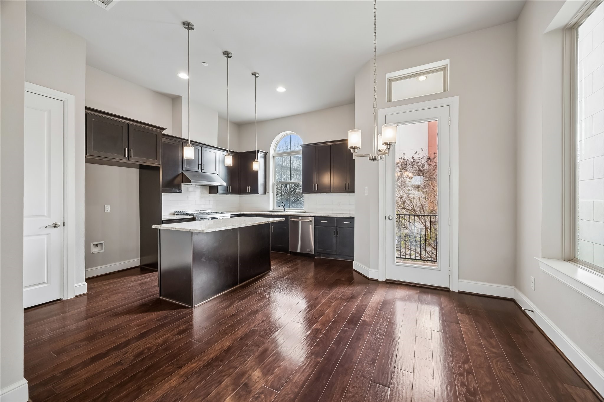 4016 Barnes Street Houston, TX 77007 - Photo 15 of 37 a kitchen with stainless steel appliances a refrigerator sink and cabinets