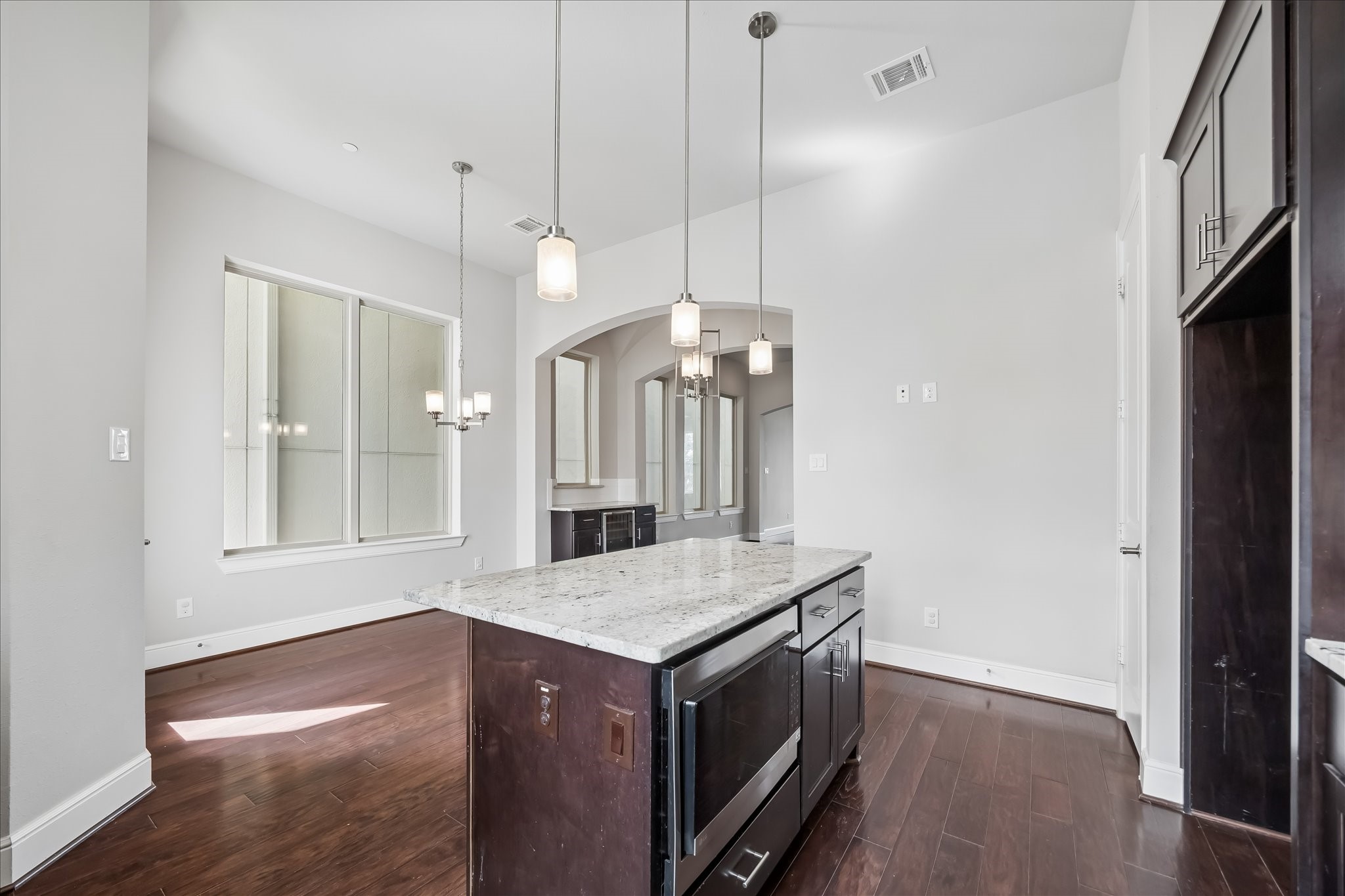 4016 Barnes Street Houston, TX 77007 - Photo 16 of 37 a view of kitchen and hall with wooden floor