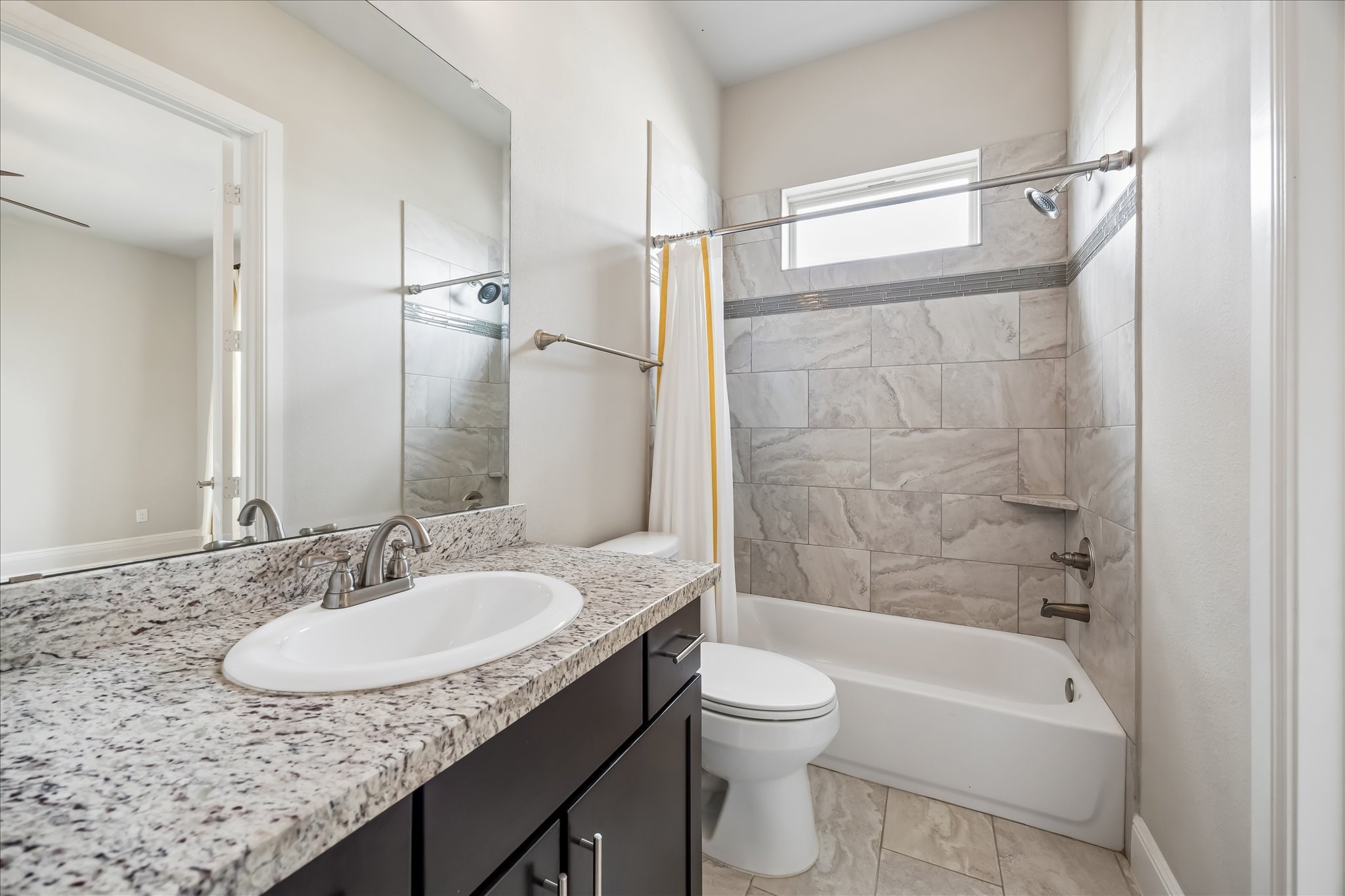 4016 Barnes Street Houston, TX 77007 - Photo 29 of 37 a bathroom with a granite countertop sink toilet and shower