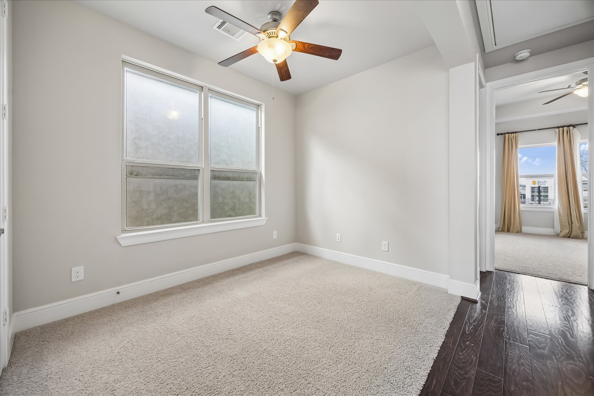 4016 Barnes Street Houston, TX 77007 - Photo 34 of 37 an empty room with windows and fan