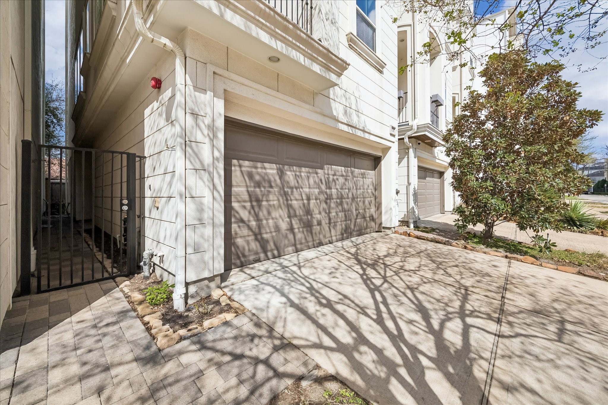 4016 Barnes Street Houston, TX 77007 - Photo 6 of 37 a outside view of a house with a wooden fence