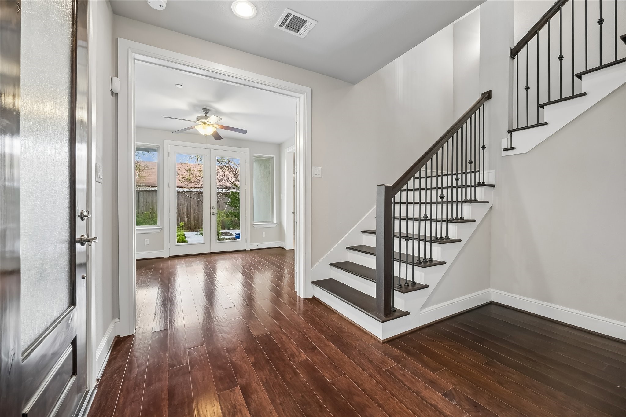 4016 Barnes Street Houston, TX 77007 - Photo 8 of 37 a view of a hallway with wooden floor and staircase