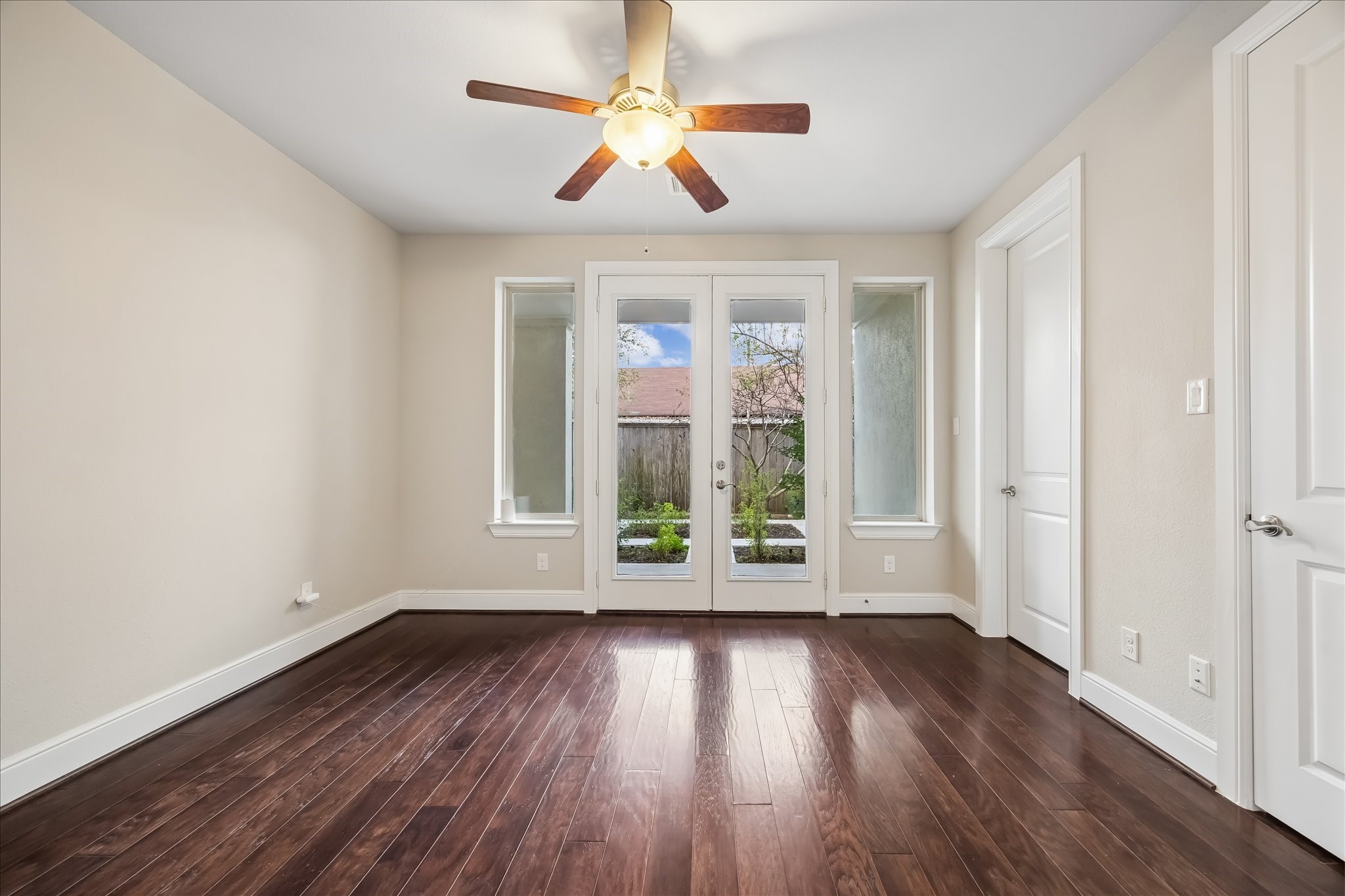 4016 Barnes Street Houston, TX 77007 - Photo 9 of 37 a view of room with wooden floor fan and window