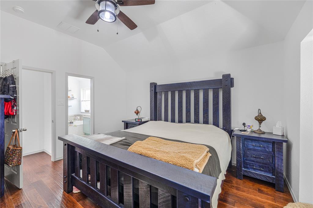 2813 Ridgemere Drive Flower Mound, TX 75028 - Photo 13 of 18 a bed room with a bed and a chandelier
