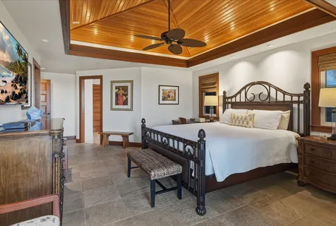 a spacious bathroom with a tub sink and mirror