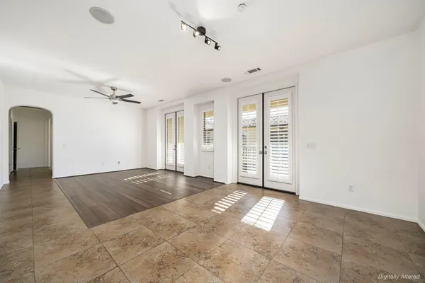 an empty room with windows and closet