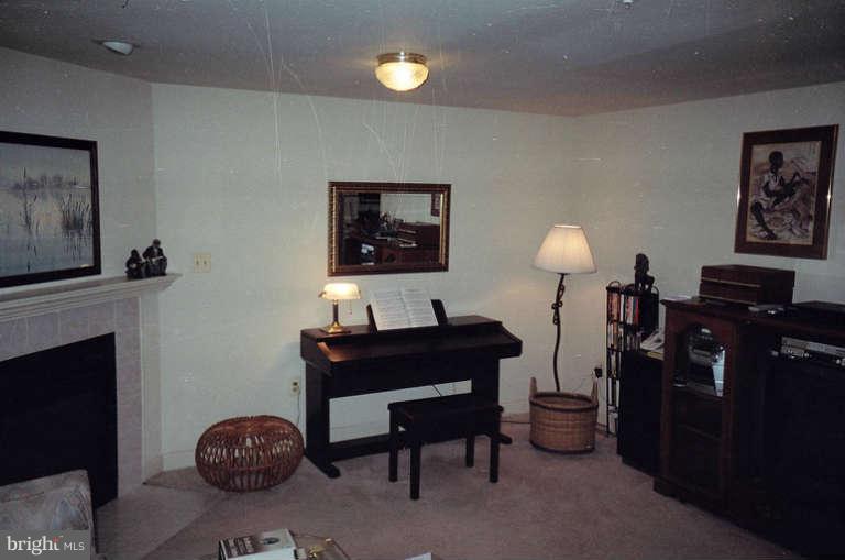 8 Chippewa Court Silver Spring, MD 20906 - Photo 13 of 30 a living room with furniture and a fireplace