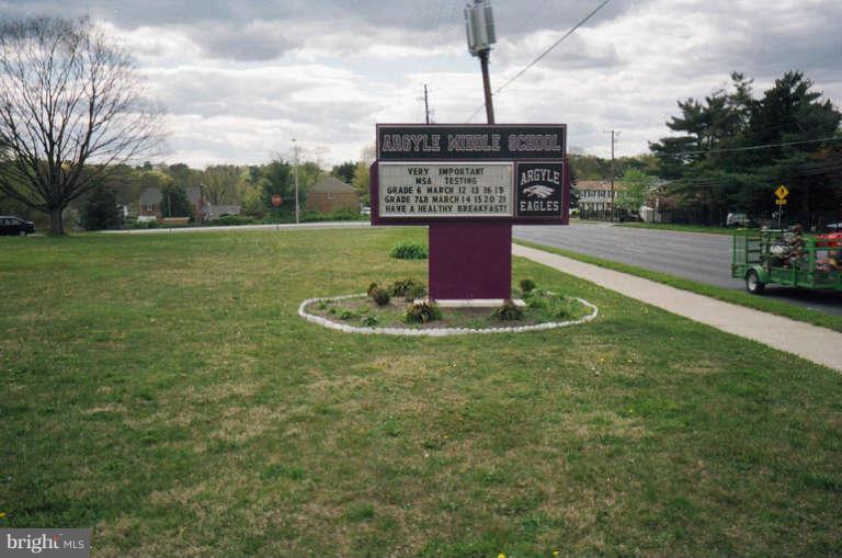8 Chippewa Court Silver Spring, MD 20906 - Photo 28 of 30 a sign that is sitting in the grass near a tree
