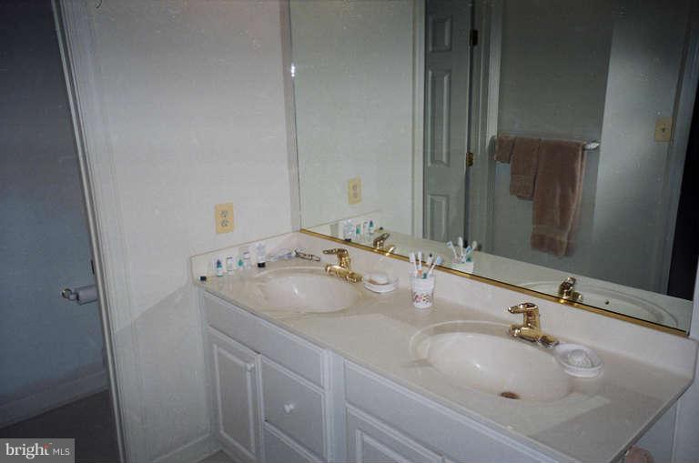 8 Chippewa Court Silver Spring, MD 20906 - Photo 5 of 30 a bathroom with a sink and a mirror
