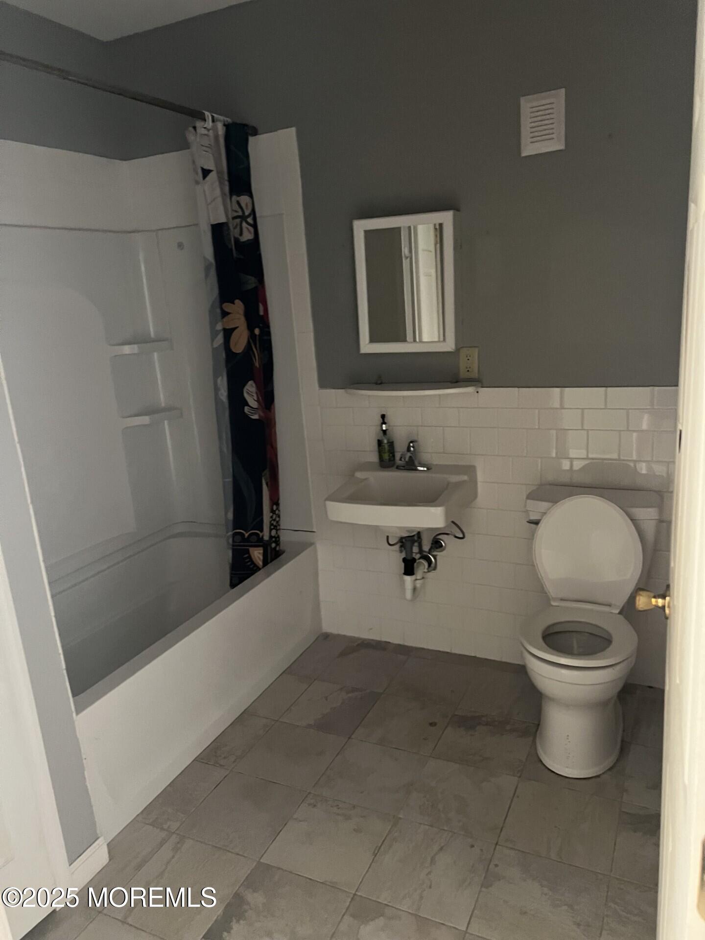 33 Vanderbilt Avenue, Unit 13 Leonardo, NJ 07737 - Photo 5 of 7 a bathroom with a toilet and a shower