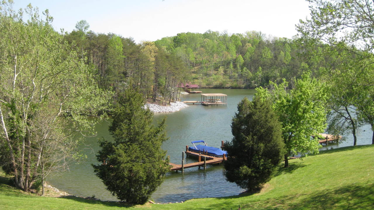 403 Harbor Ridge Drive Goodview, VA 24095 - Photo 2 of 11 a view of a lake with a mountain