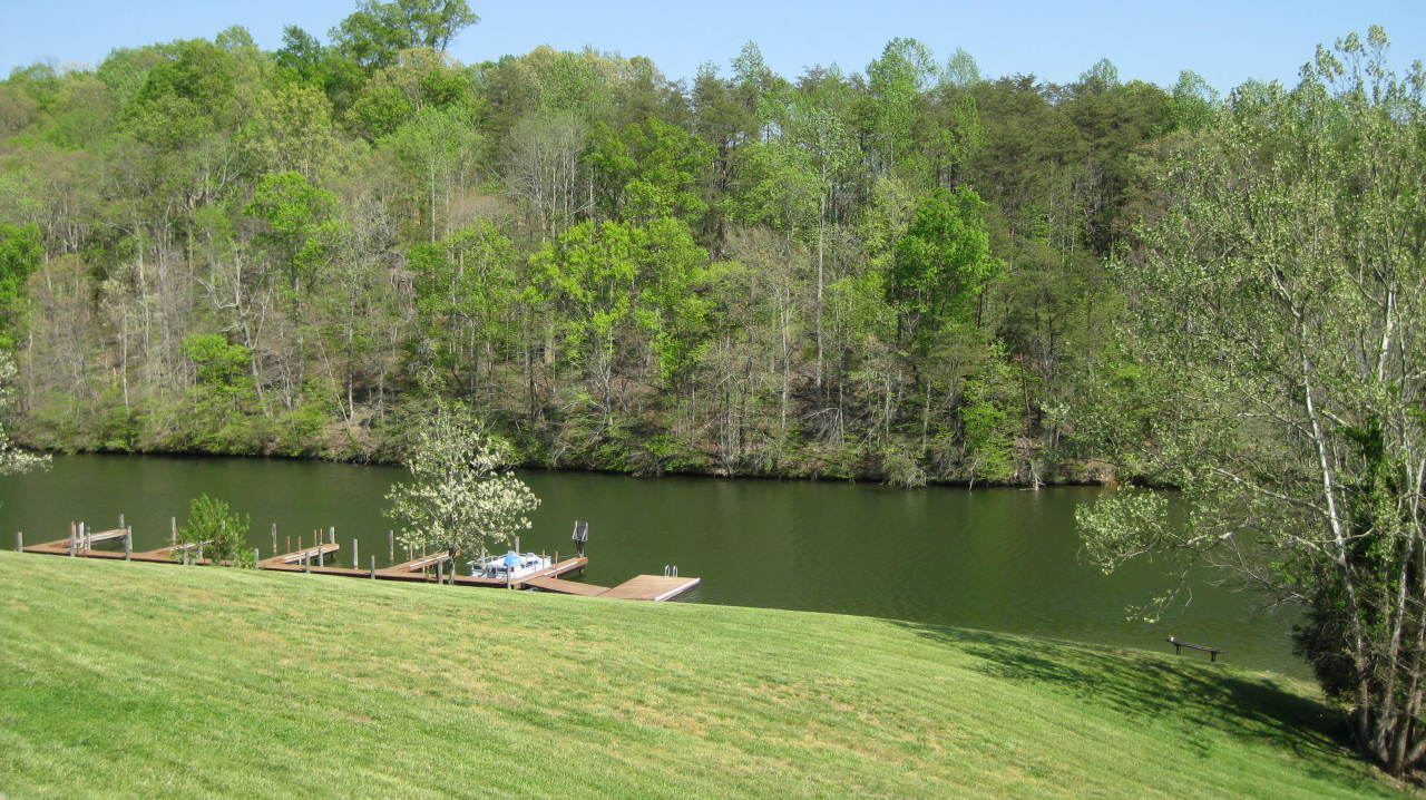 403 Harbor Ridge Drive Goodview, VA 24095 - Photo 3 of 11 a view of a lake with houses in the background