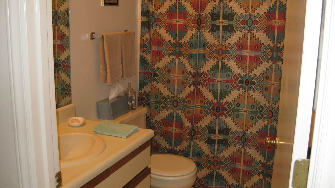 403 Harbor Ridge Drive Goodview, VA 24095 - Photo 7 of 11 a bathroom with a granite countertop sink toilet and shower