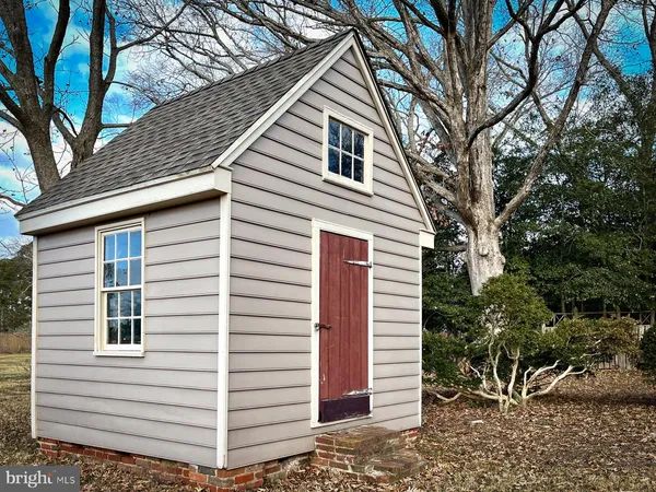 a bedroom with a bed and a table