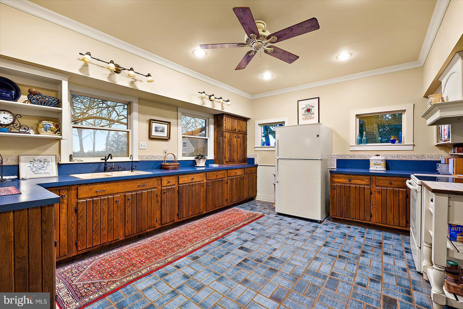 27947 Fairmount Road Westover, MD 21871 - Photo 65 of 122 a kitchen with stainless steel appliances granite countertop a sink stove and refrigerator