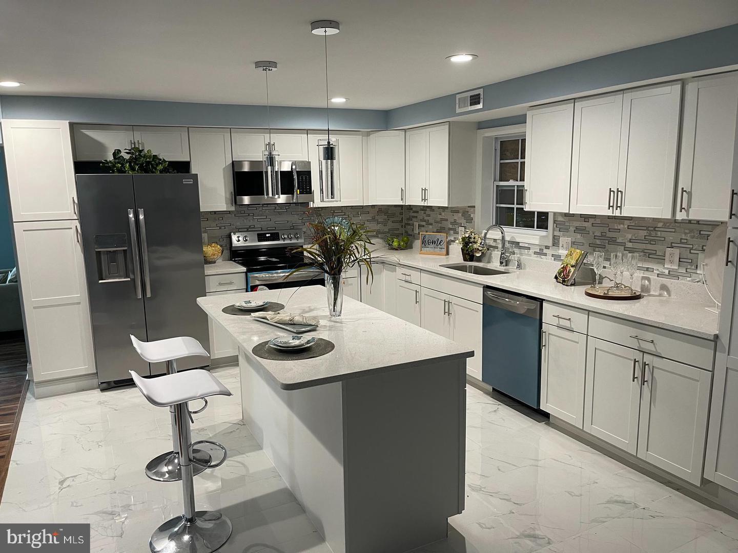 6303 Field Street Capitol Heights, MD 20743 - Photo 9 of 27 Entertain and prepare meals with ease in kitchen