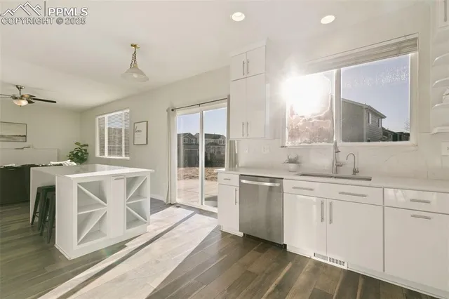 a spacious bathroom with a double vanity sink a mirror and a bathtub