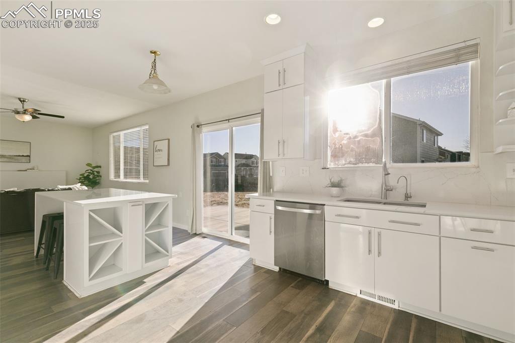 9202 Ballybunion Road Peyton, CO 80831 - Photo 11 of 36 a spacious bathroom with a double vanity sink a mirror and a bathtub