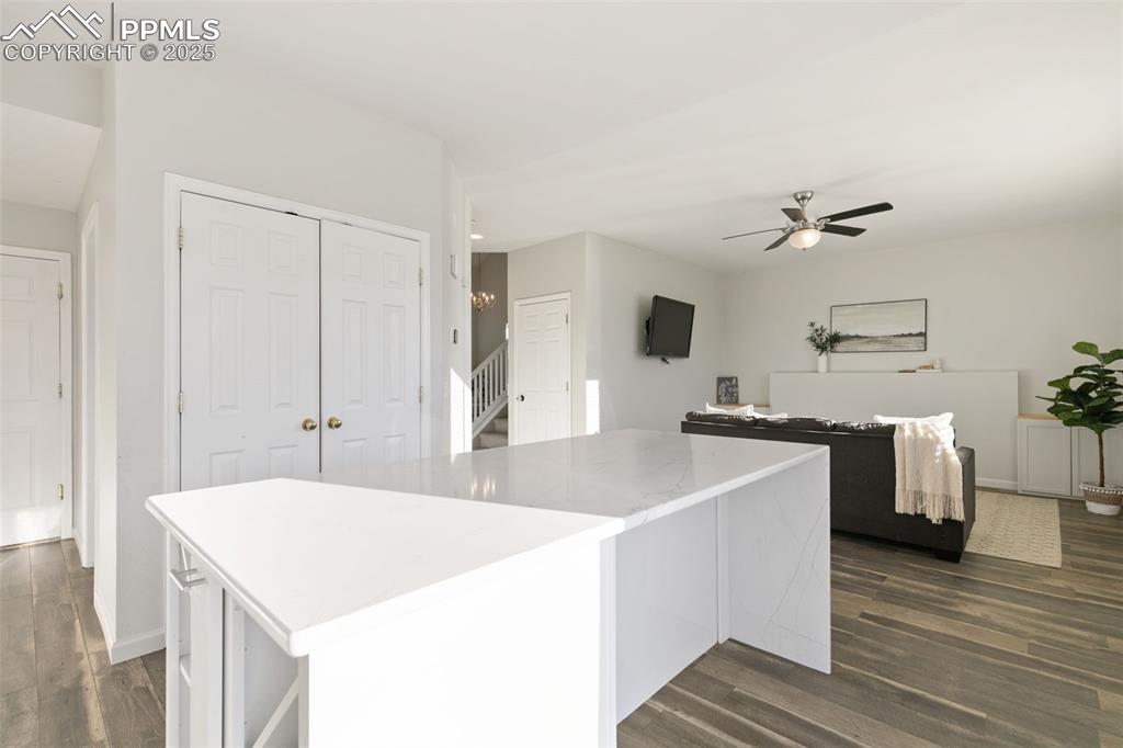 9202 Ballybunion Road Peyton, CO 80831 - Photo 16 of 36 a room with kitchen island a sink and stove
