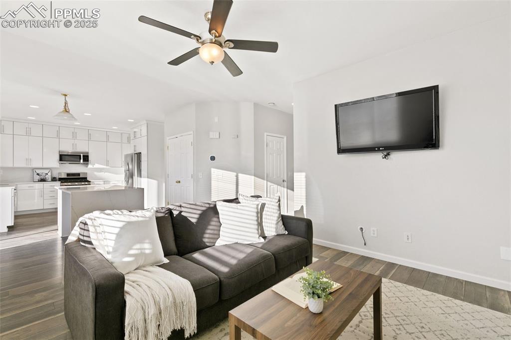 9202 Ballybunion Road Peyton, CO 80831 - Photo 20 of 36 a living room with furniture and a flat screen tv