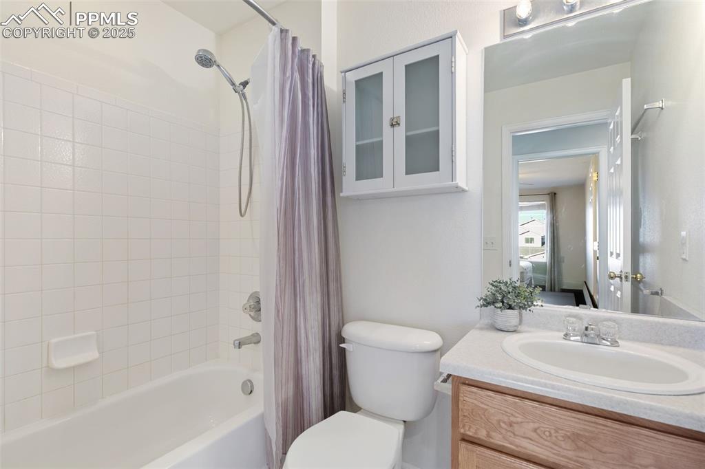 9202 Ballybunion Road Peyton, CO 80831 - Photo 32 of 36 a bathroom with a sink toilet and shower