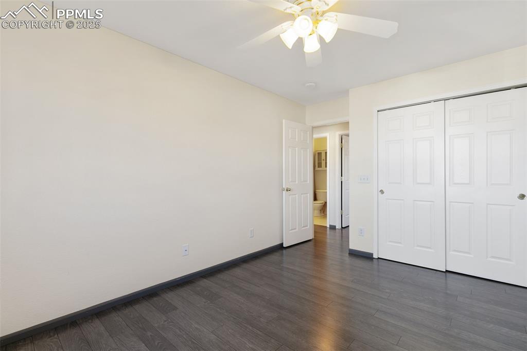 9202 Ballybunion Road Peyton, CO 80831 - Photo 34 of 36 a view of an empty room with wooden floor