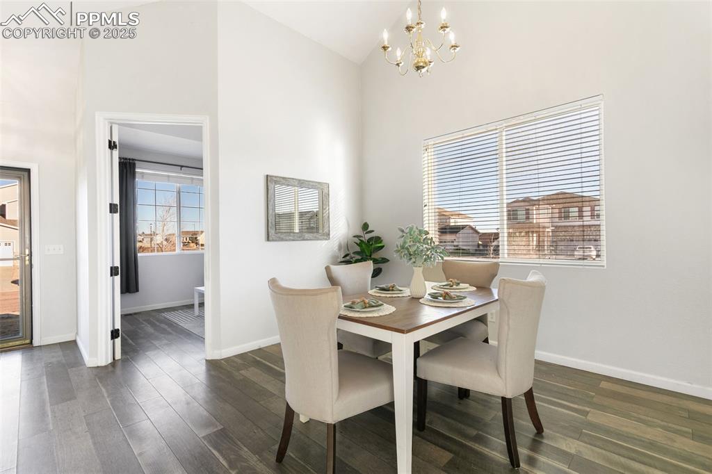 9202 Ballybunion Road Peyton, CO 80831 - Photo 5 of 36 a dining room with furniture window and wooden floor