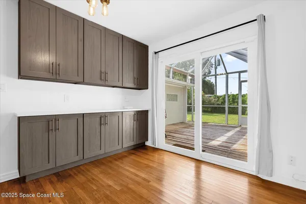 a kitchen with stainless steel appliances a refrigerator and a stove top oven