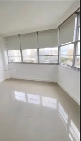 a white toilet sitting next to a bathroom sink and a shower