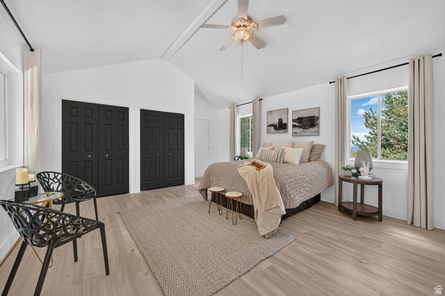 1979 Cave Hollow Way Bountiful, UT 84010 - Photo 20 of 59 Spacious room featuring vaulted ceilings, light wood-finish flooring, two large windows, and a ceiling fan with integrated lighting