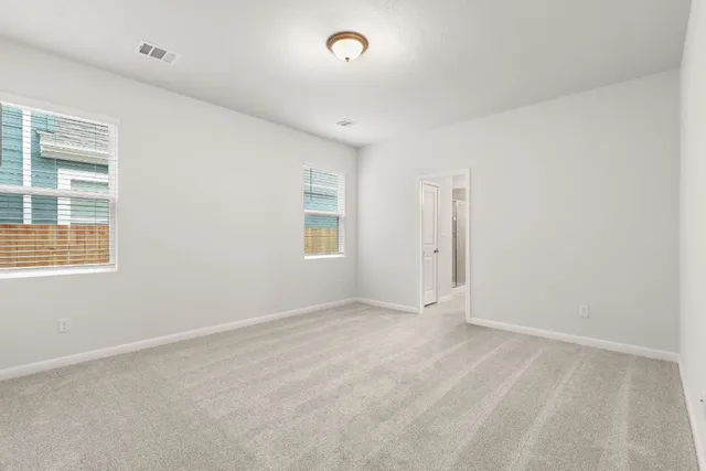 an empty room with windows