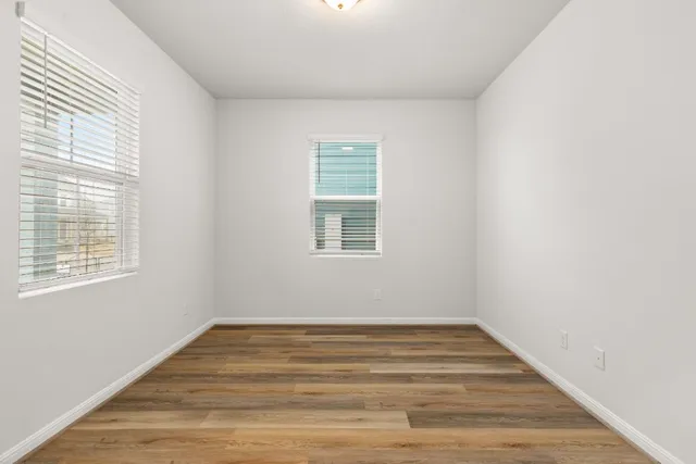 wooden floor and white walls