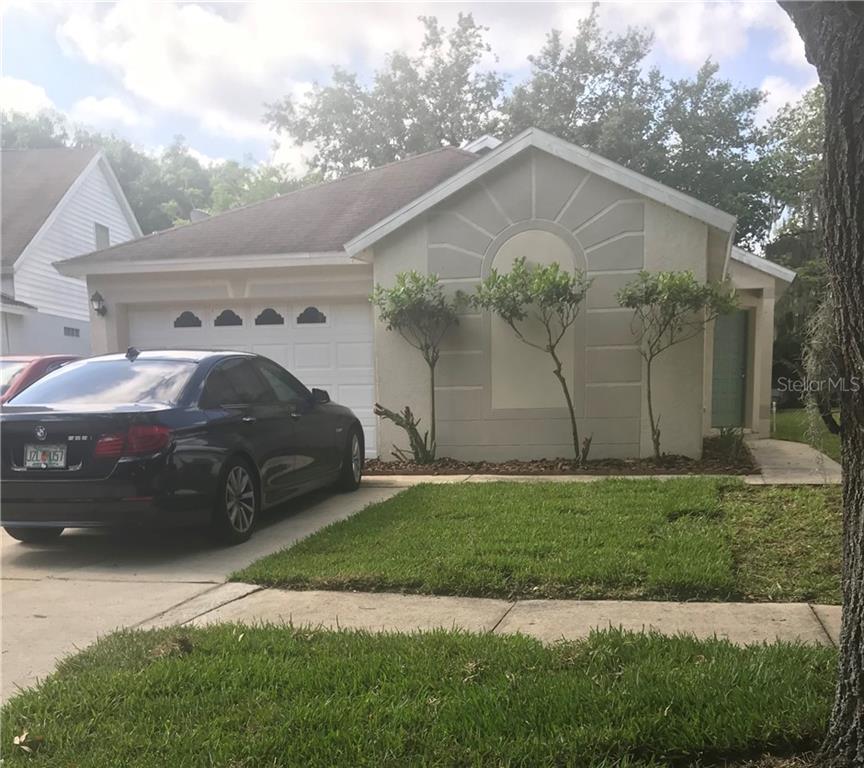5814 Tanagerlake Road Lithia, FL 33547 - Photo 1 of 1 a front view of a house with garden