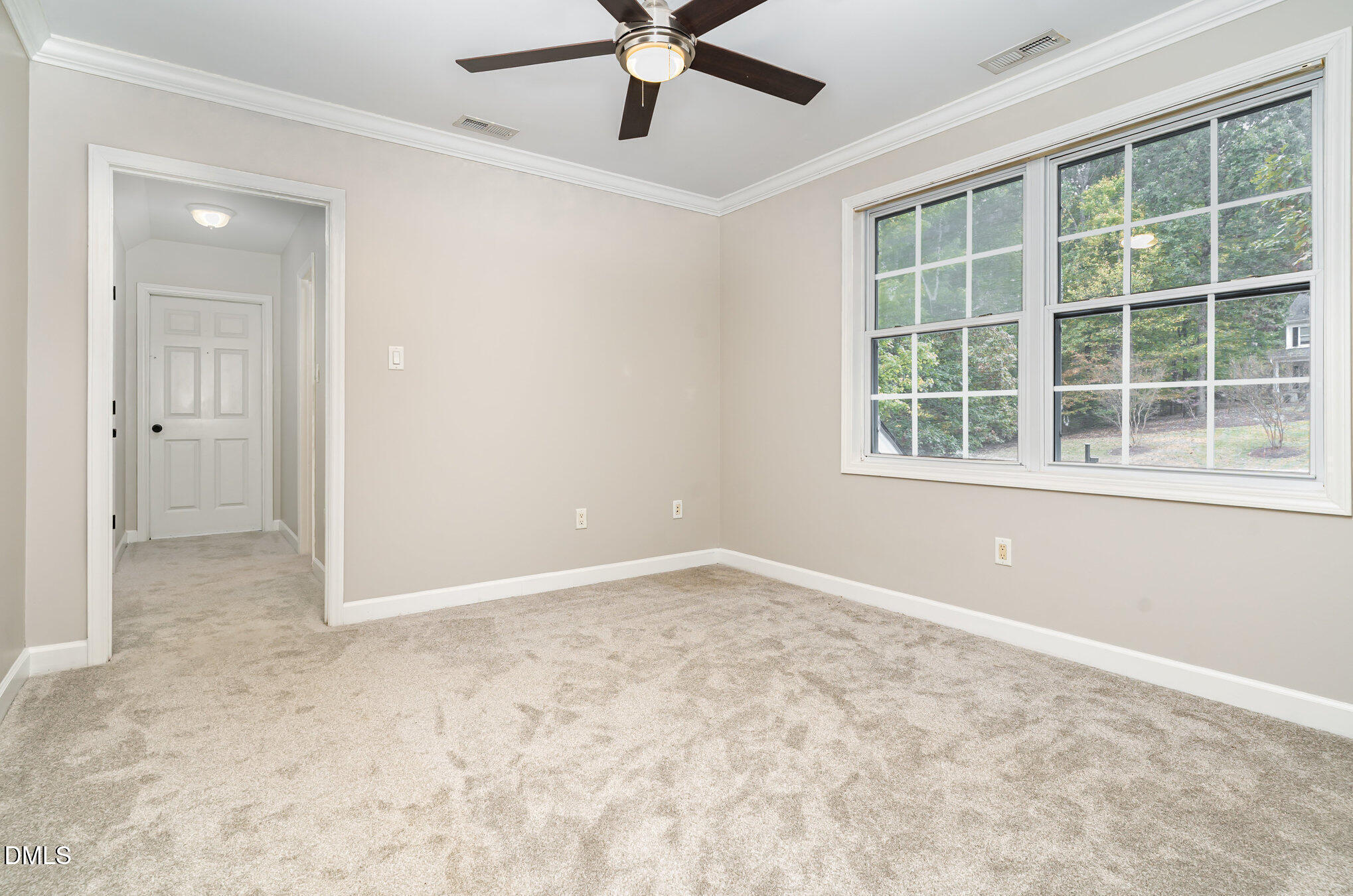 9036 Sundance Street Wake Forest, NC 27587 - Photo 13 of 22 an empty room with window and a ceiling fan