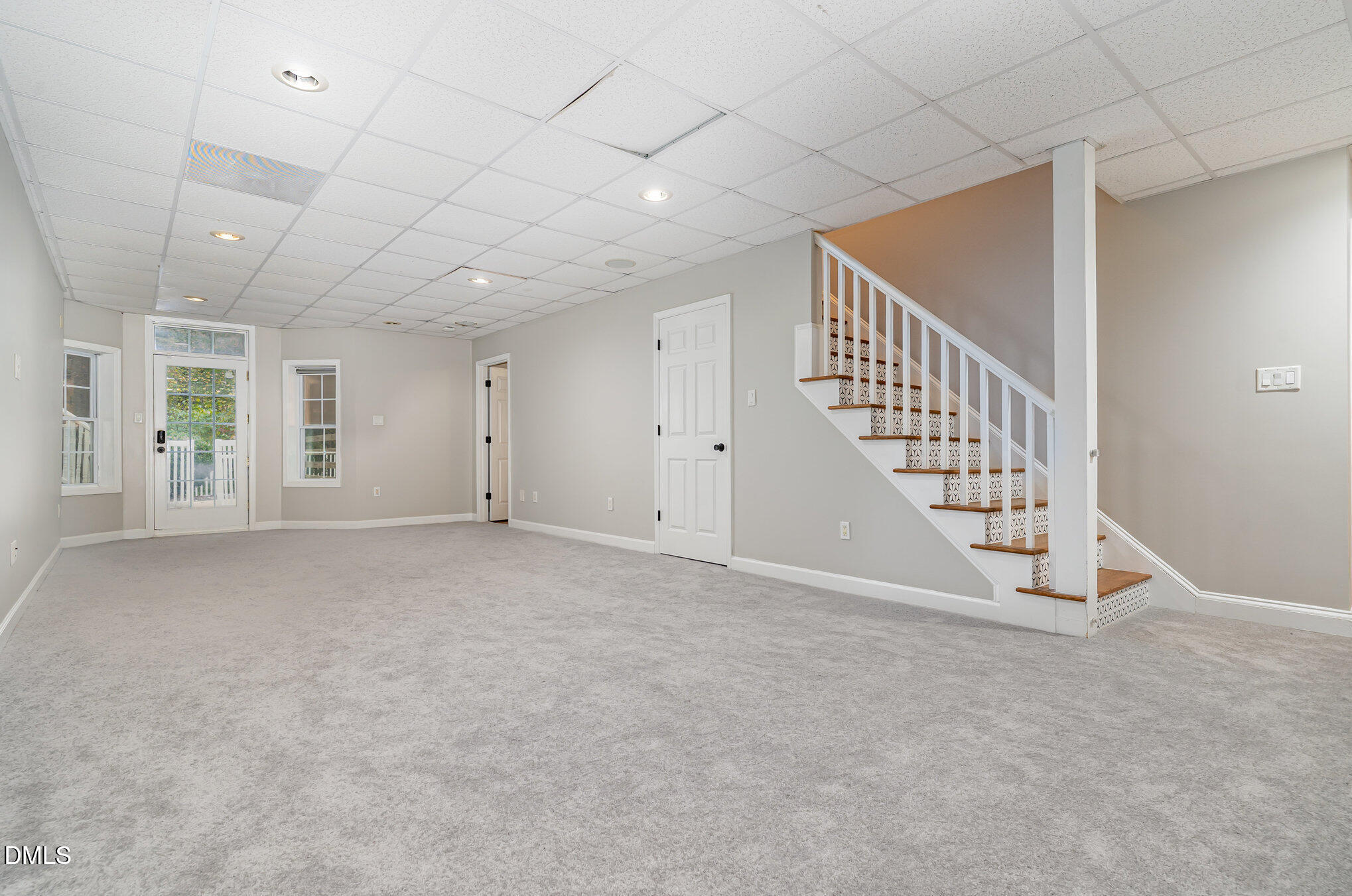 9036 Sundance Street Wake Forest, NC 27587 - Photo 14 of 22 a view of an empty room with staircase