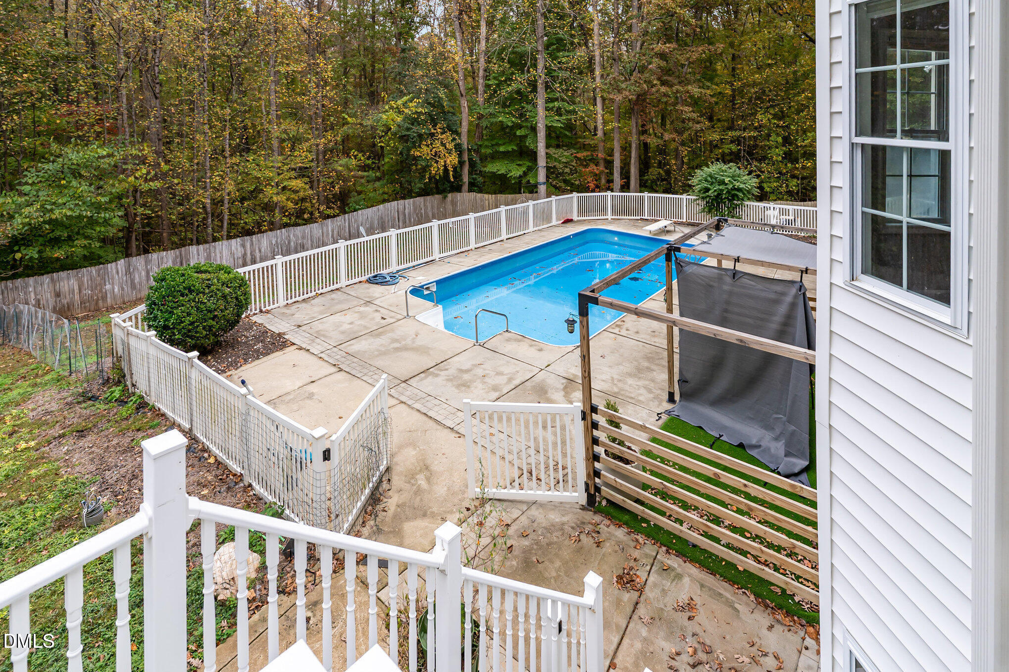 9036 Sundance Street Wake Forest, NC 27587 - Photo 21 of 22 a view of a balcony with two chairs and a gate