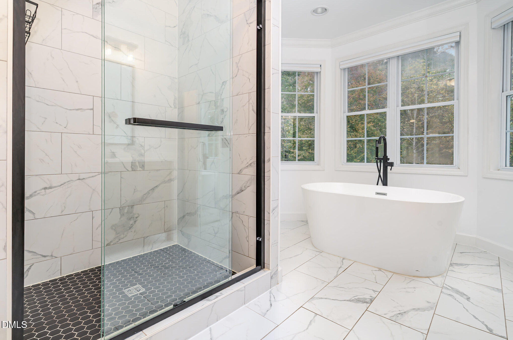 9036 Sundance Street Wake Forest, NC 27587 - Photo 10 of 22 a bathroom with a bathtub and shower