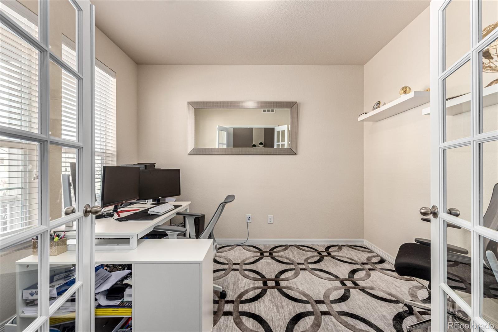 21074 East Doane Place Aurora, CO 80013 - Photo 34 of 44 a view of a workspace with furniture and a window