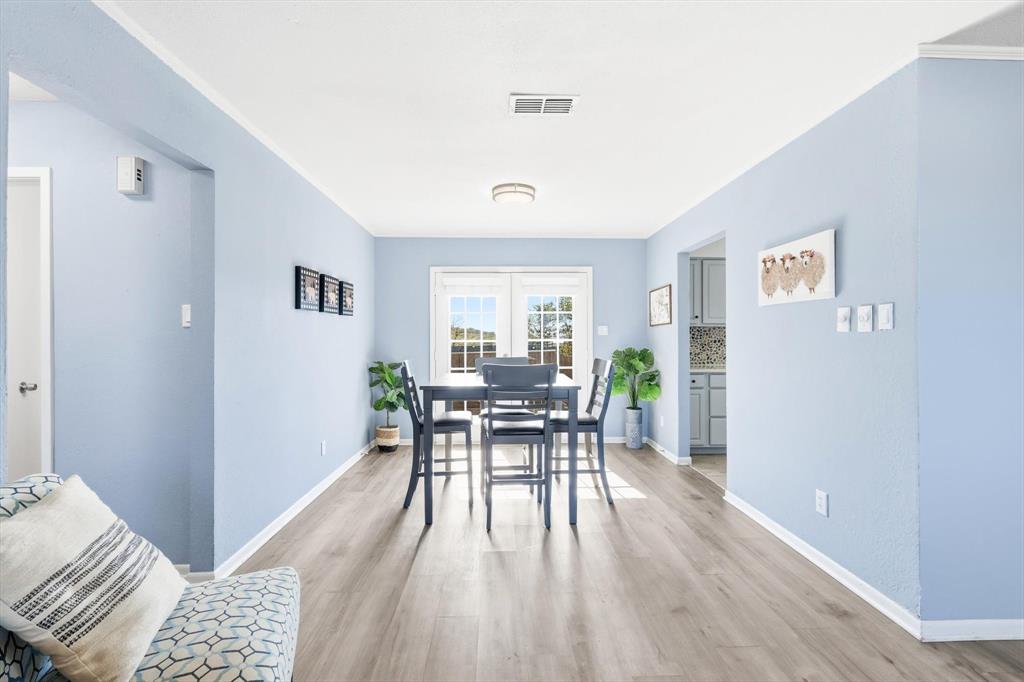 3873 Lois Road East Sanger, TX 76266 - Photo 15 of 40 Dining room featuring light wood finished floors and baseboards