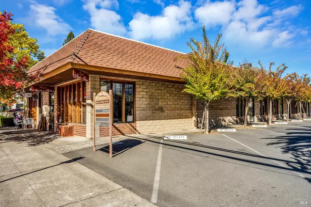 a view of a house with basketball court
