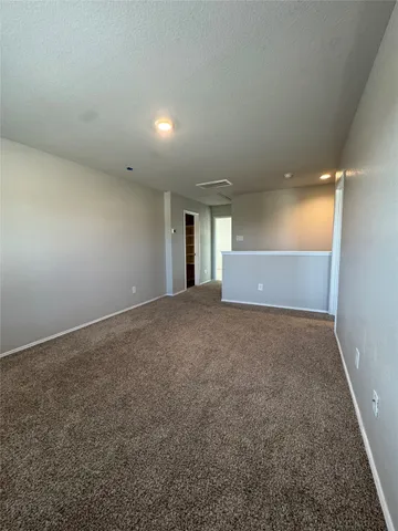 an empty room with a bench