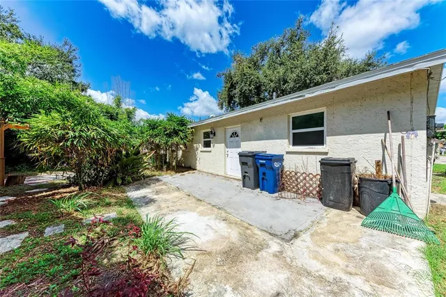 a view of a backyard with a iron fence