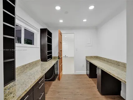 a kitchen with a stove and a sink