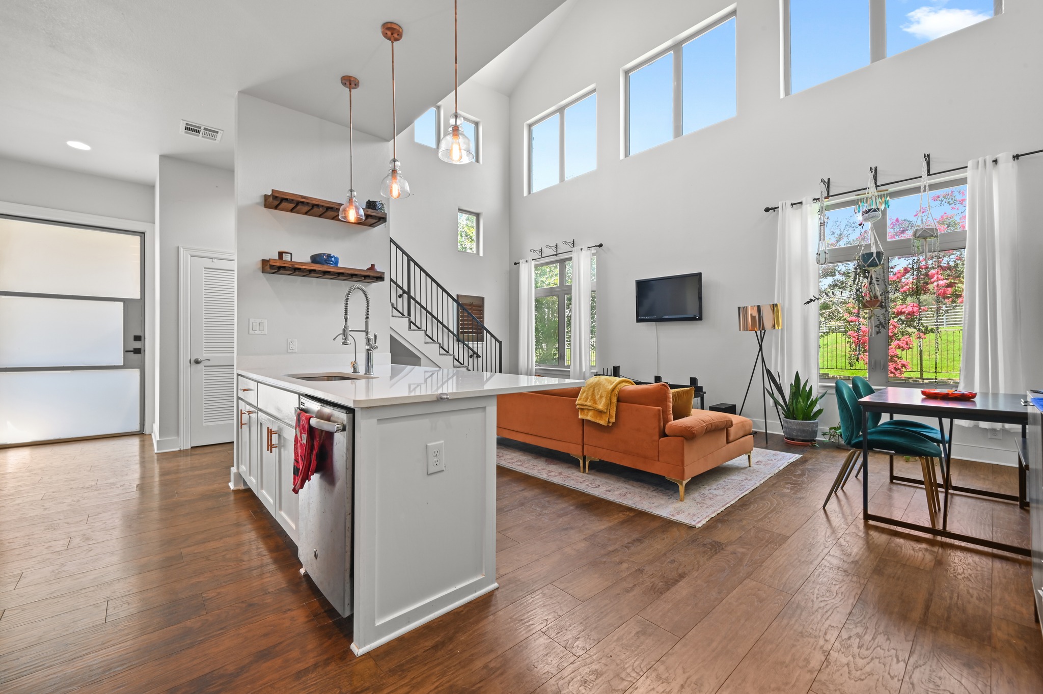 592 Farm To Market 967, Unit B Buda, TX 78610 - Photo 8 of 26 From every angle, the thoughtfully designed open layout shines, seamlessly connecting the kitchen, living area, and entryway to create a space that feels both spacious and inviting.