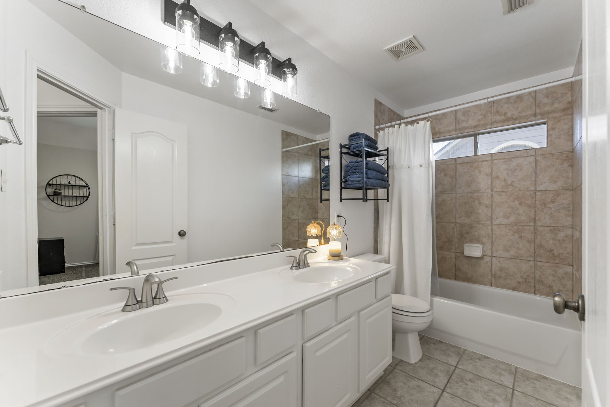 2106 Leaf Meadows Court Spring, TX 77386 - Photo 22 of 34 a bathroom with a bathtub shower sink vanity and toilet