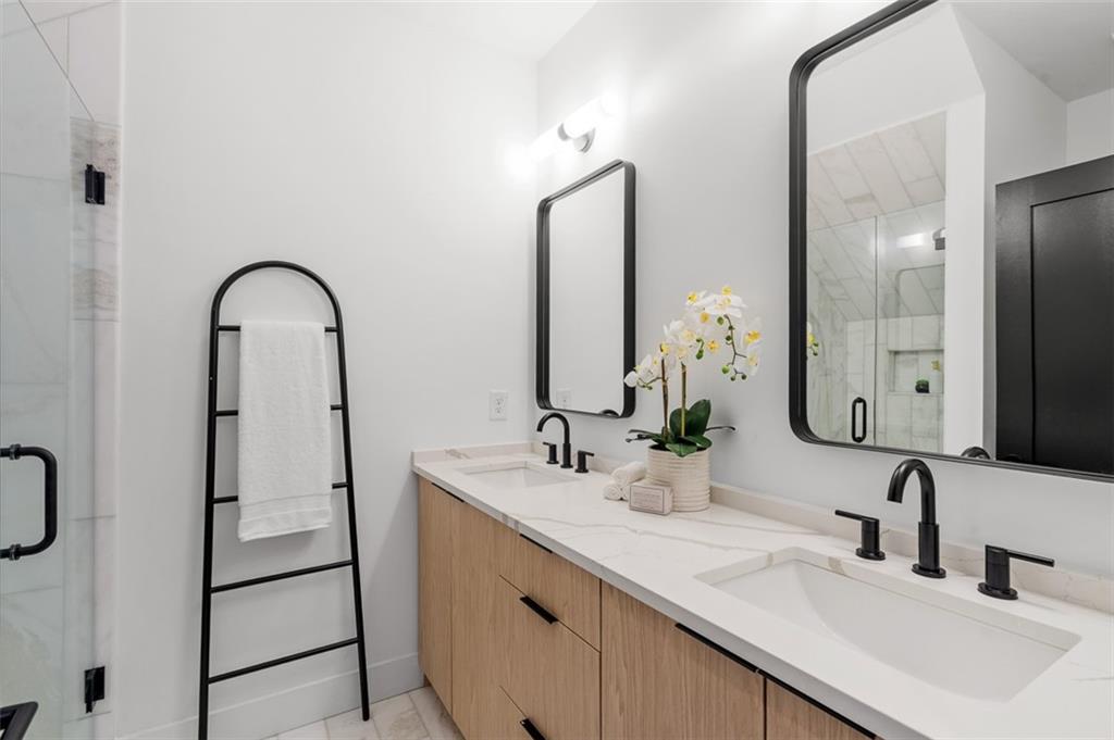 1165 Penny Lane Atlanta, GA 30329 - Photo 22 of 40 a bathroom with a double vanity sink and a mirror