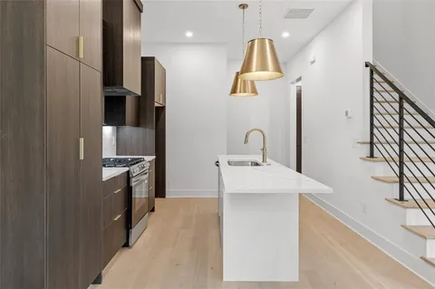 a kitchen with sink and window